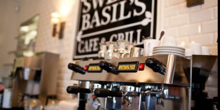 Expresso Machine in Front of Sweet Basil Sign