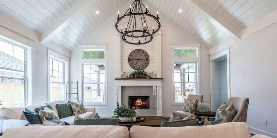 bold chandelier and ceiling treatment in transitional style living room