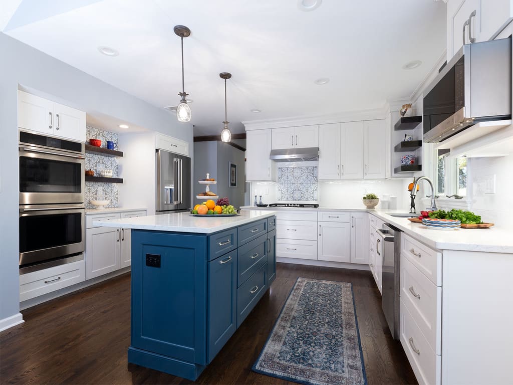 Two Tone kitchen remodel with blue island, white cabinetry and dark hardwood (1)