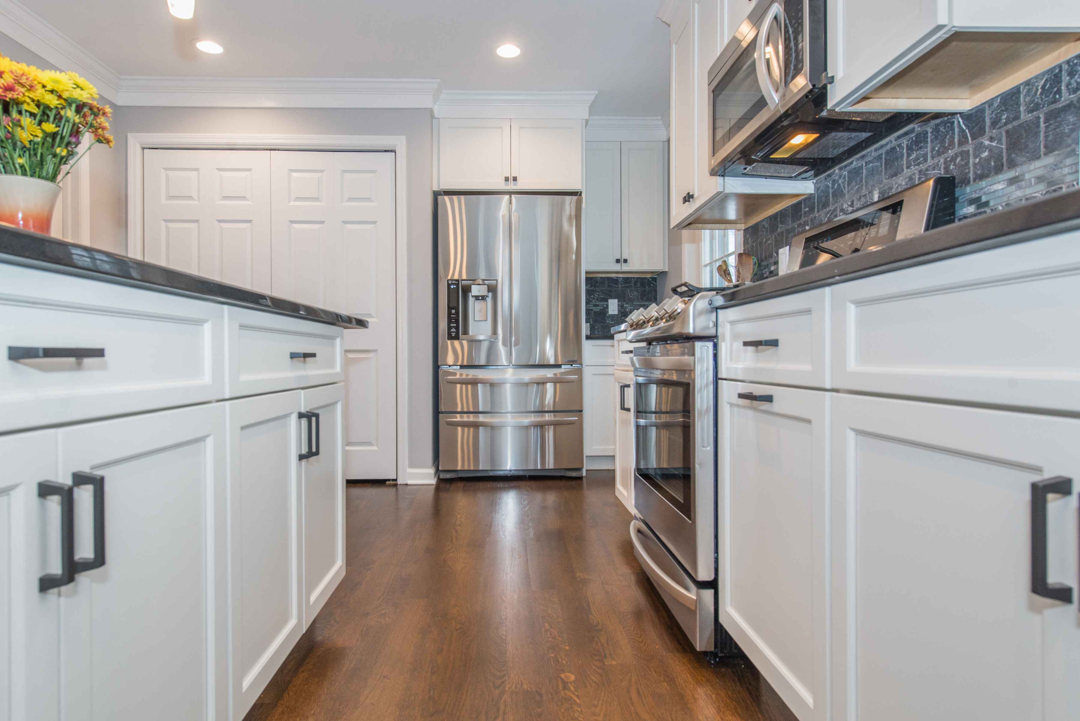 kitchen with white cabinets and island