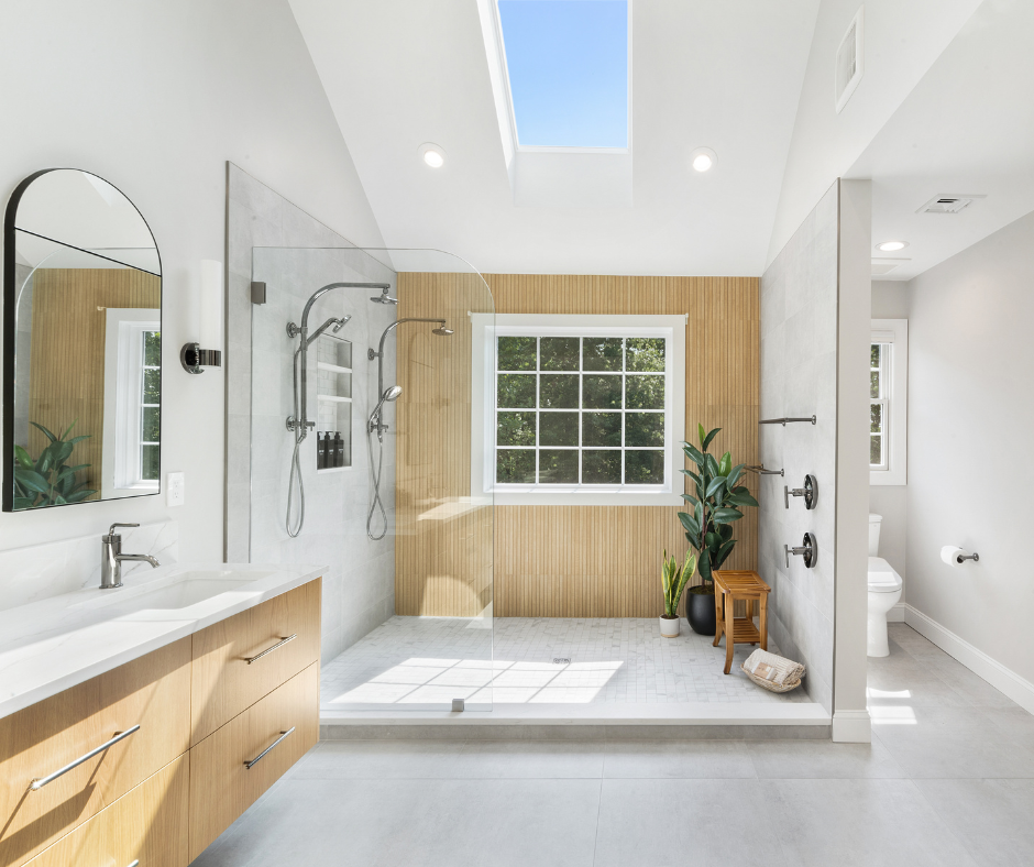 Spa-like primary bathroom remodel with walk-in bamboo style shower wall and glass enclosure