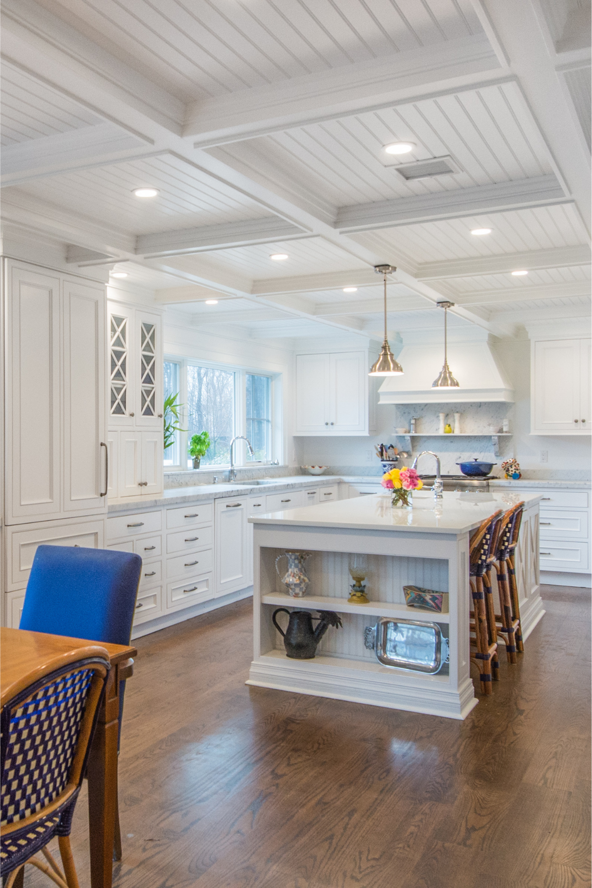Spacious kitchen island with white quartz countertops—ideal for hosting and gathering in a bright, inviting space. Spacious kitchen island with white quartz countertops—ideal for hosting and gathering in a bright, inviting space.