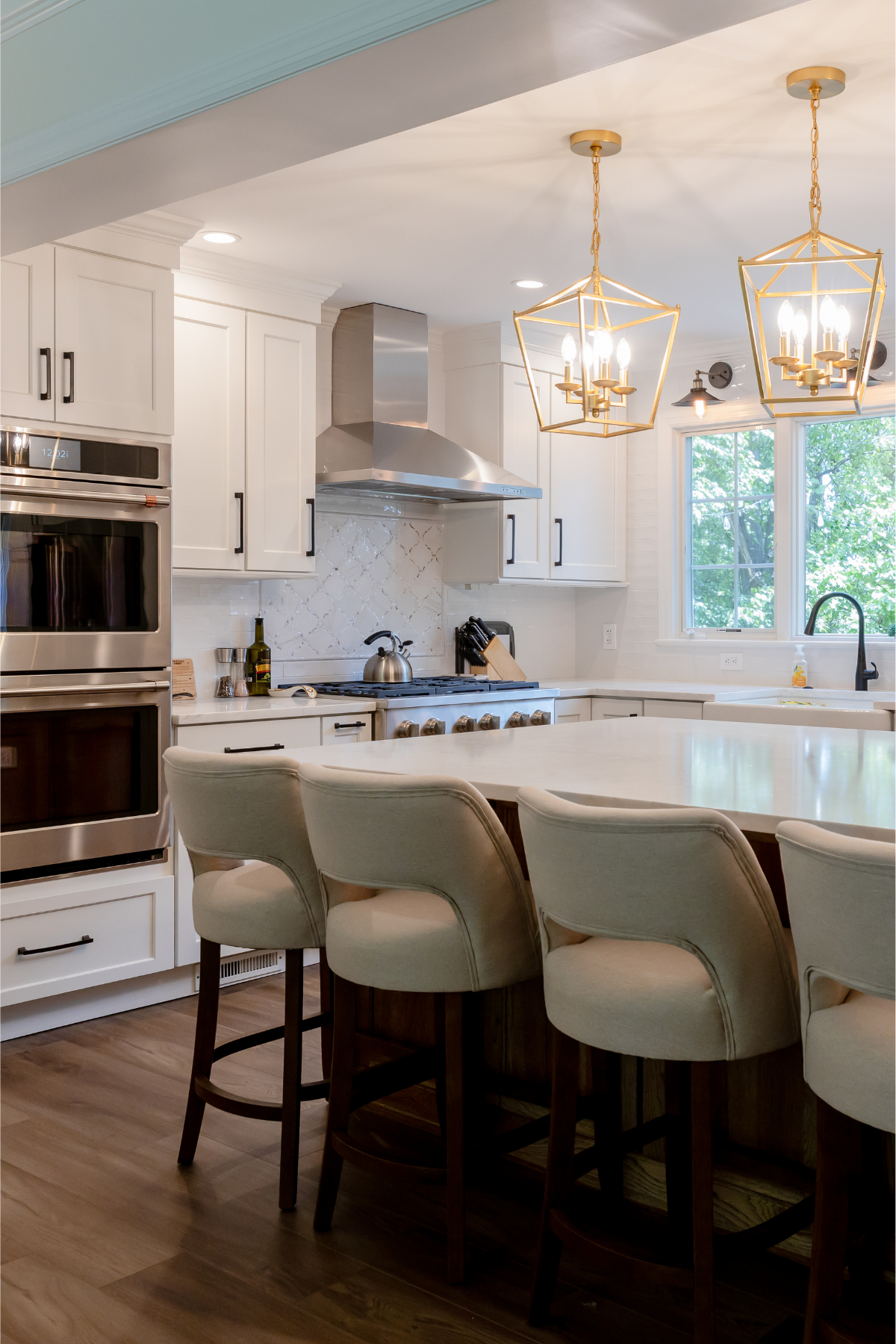 Bright white kitchen with sleek cabinetry, light countertops, and stainless steel appliances, creating a clean and timeless look. Bright white kitchen with sleek cabinetry, light countertops, and stainless steel appliances, creating a clean and timeless look.