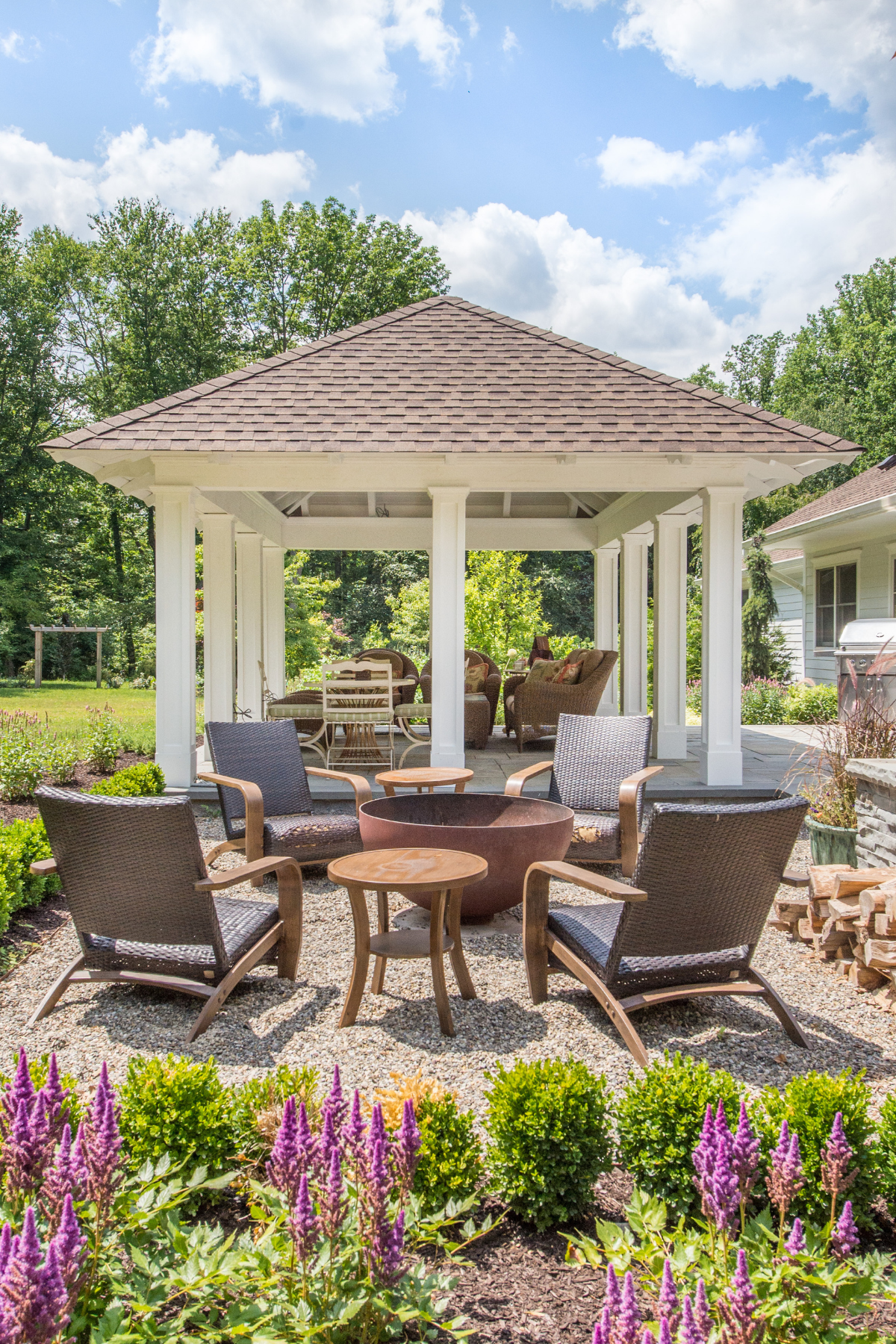 Beautiful outdoor seating area with a stylish overhang, nestled in a lush garden setting—perfect for relaxing and entertaining. Beautiful outdoor seating area with a stylish overhang, nestled in a lush garden setting—perfect for relaxing and entertaining.