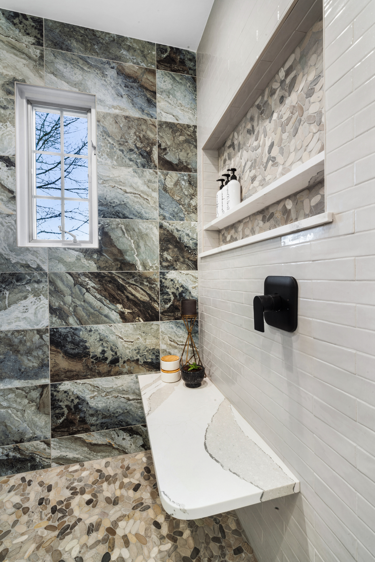 “Marble shower seat paired with spa-inspired tiles and a built-in shower niche, creating a luxurious and functional bathroom retreat “Marble shower seat paired with spa-inspired tiles and a built-in shower niche, creating a luxurious and functional bathroom retreat