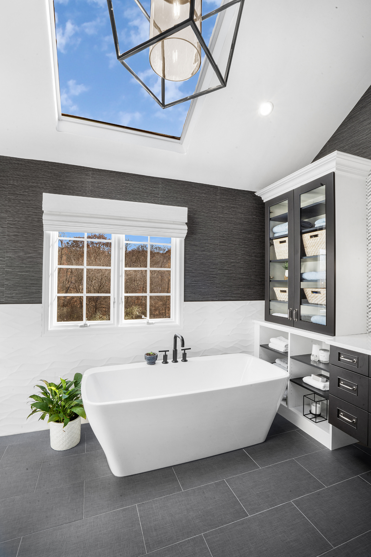 Elegant freestanding bathtub positioned as the focal point of a modern bathroom, offering a relaxing and stylish retreat