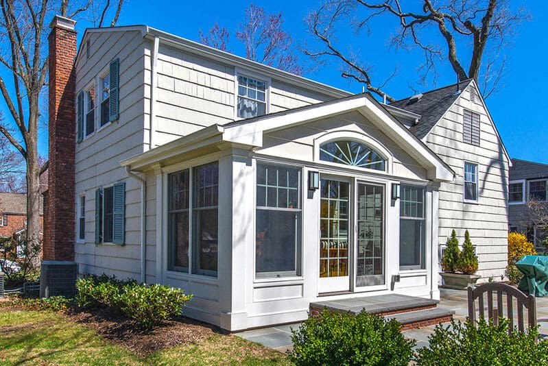 Exterior Sunroom with French doors and arch window in Chatham, NJ renovated by JMC Home Improvement Specialists