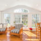 White Sunroom with vaulted ceiling and transom window in Chatham, NJ renovated by JMC Home Improvement Specialists