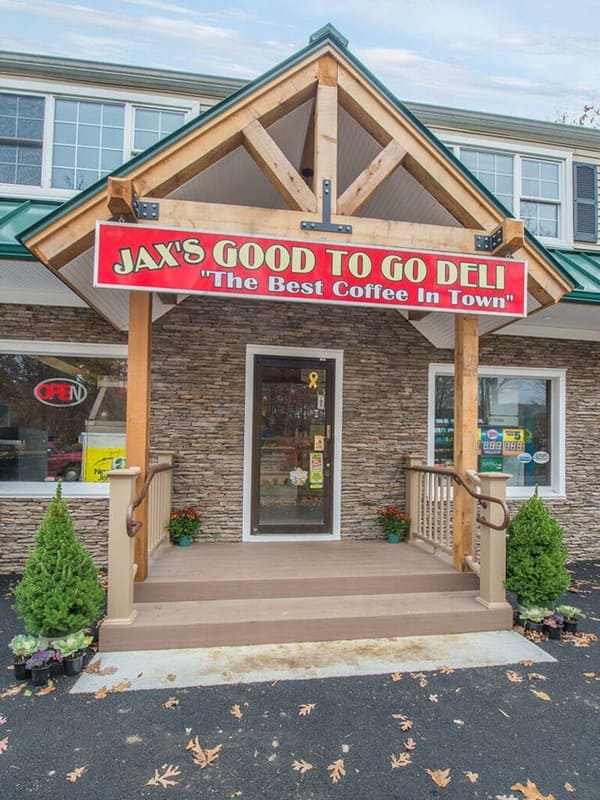 Store Front Enterance with Wood Beams and Metal Roof  Renovated by JMC Home Improvement Specialists