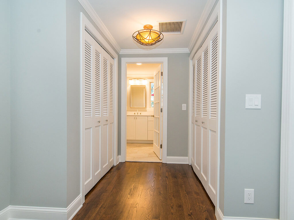 Upstairs hallway with laundry in closet In Springfield, New Jersey renovated by JMC Home Improvement Specialists