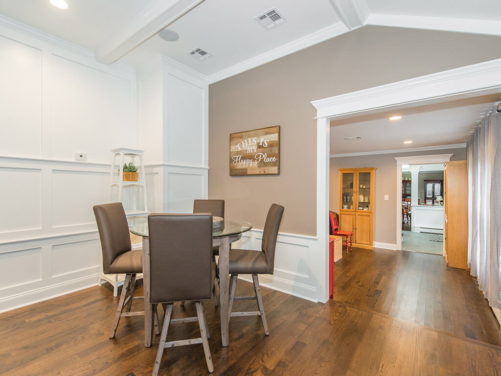 Seating area in family room with vaulted ceiling and custom wood working In Randolph, NJ renovated by JMC Home Improvement Specialists