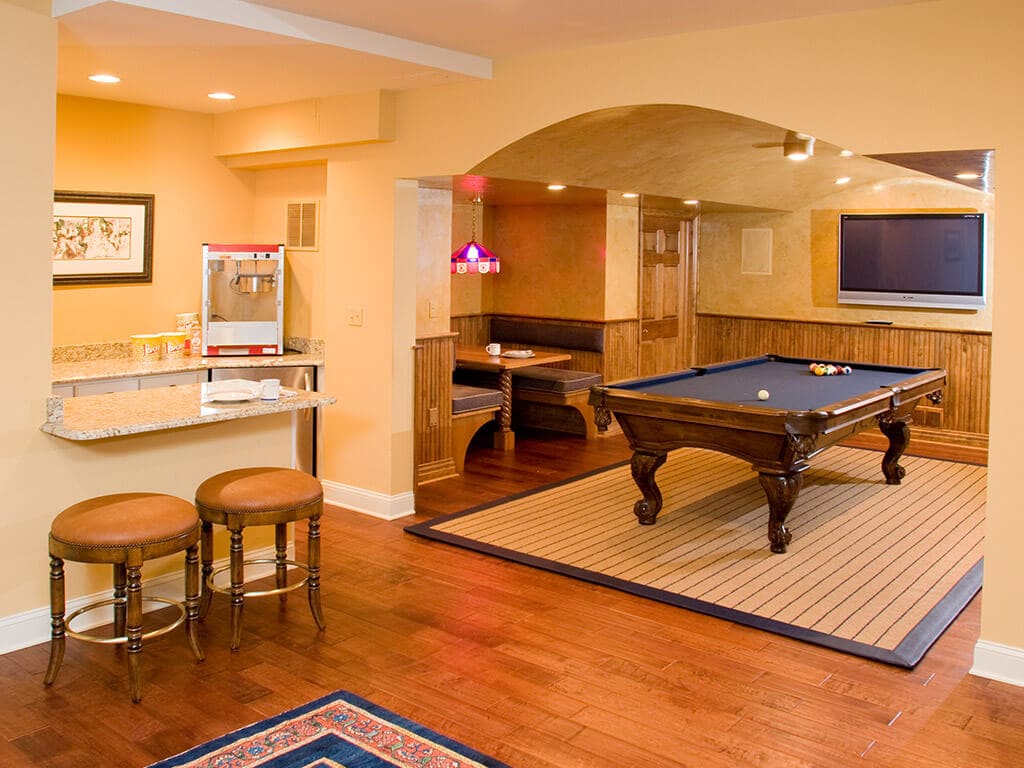 Award Winning Basement remodel with kitchenette, pool room with built in bench diner seating with curve ceiling with and finishing in Randolph New Jersey Renovated by JMC Home Improvement Specialists