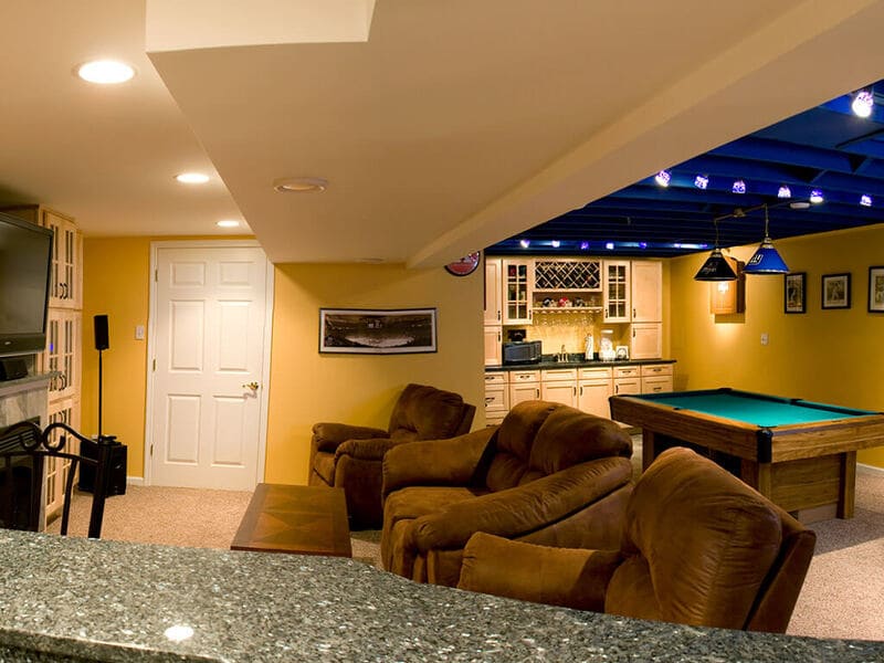 NY Giants-Inspired blue ceiling with game room Basement Remodel in Sparta NJ by JMC Home Improvement Specialists