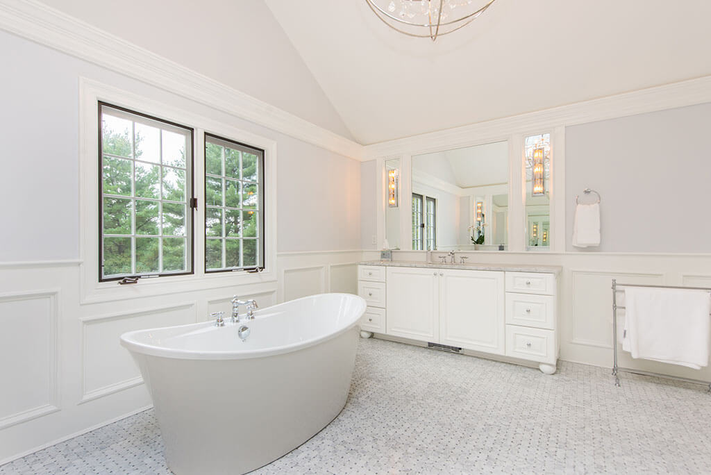 Award Winning Elegant White Master Bathroom Remodel with Custom Wood Panel and Sconces with Soaking Tub in Morris Township New Jersey Renovated by JMC Home Improvement Specialists