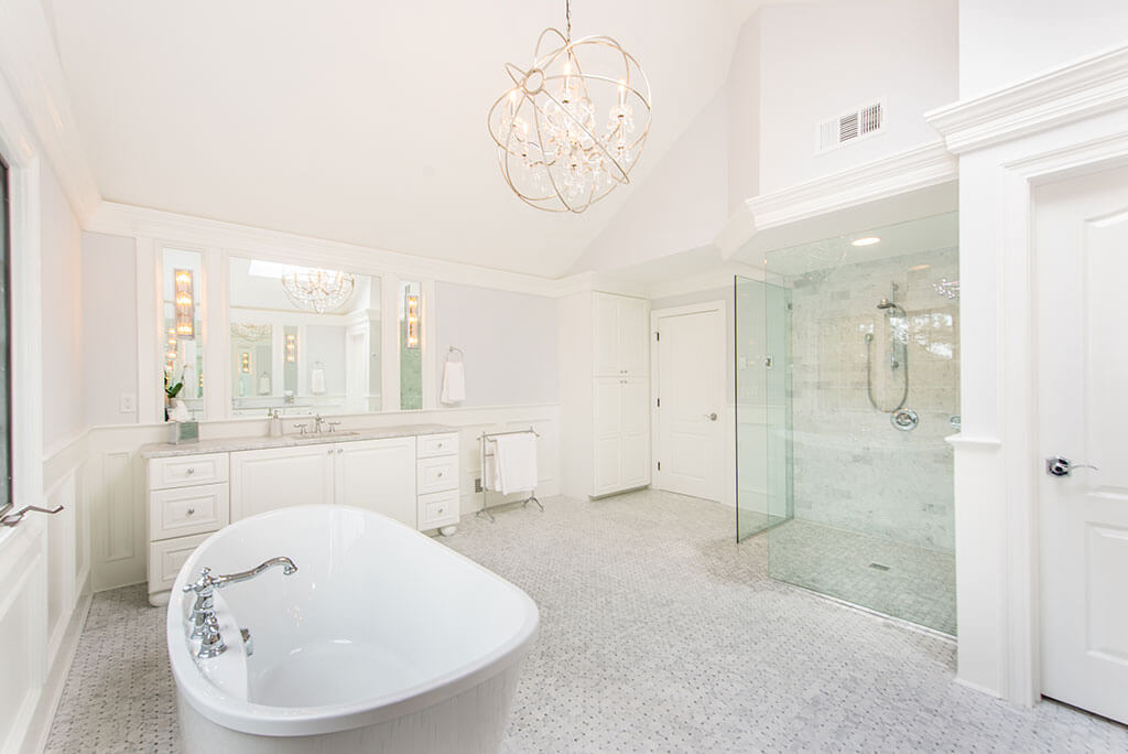 Award Winning Elegant Master Bathroom with Soaking Tub with Quartz Countertop Vanities In Morris Township New Jersey by JMC Home Improvement Specialists