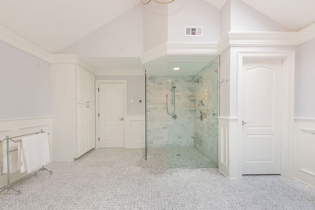 Award Winning Elegant Master Bathroom two Person Walk-In Shower with Basketweave tile floor In Morris Township New Jersey by JMC Home Improvement Specialists