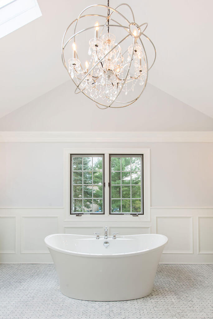 Award Winning Elegant White Master Bathroom Soaking Tub With Chandelier in Morris Township New Jersey by JMC Home Improvement Specialists