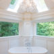 Award Winning Freestanding soaking tub with chandelier bathroom remodel in Sparta NJ renovated by JMC Home Improvement Specialists