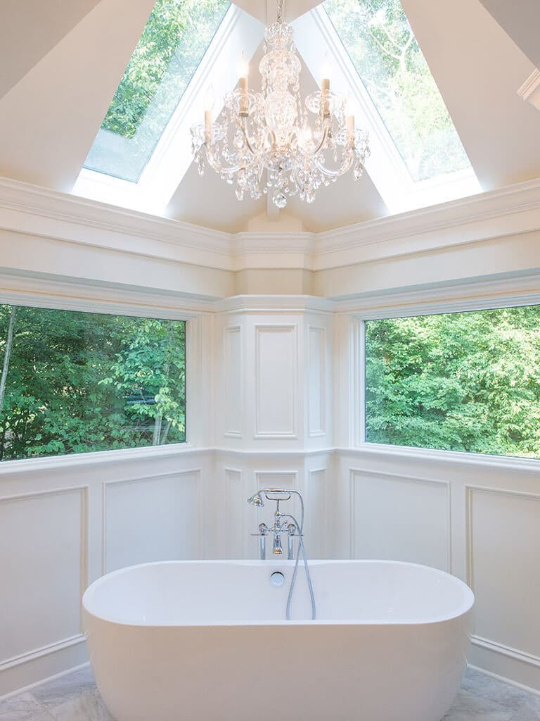 Award Winning Freestanding soaking tub with chandelier bathroom remodel in Sparta NJ renovated by JMC Home Improvement Specialists