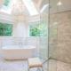 Vaulted Ceiling with skylight, freestanding soaking tub with walk-in shower with frameless glass and Carrera marble white master bath in Sparta, NJ Renovated by JMC Home Improvement Specialists