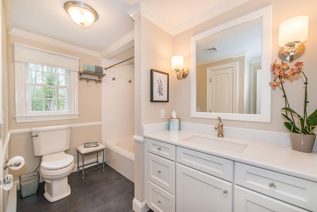Hall bathroom remodel with white framed mirror and white vanity, shower and tub, with crown molding in Boonton, NJ renovated by JMC Home Improvement Specialists Hall bathroom remodel with white framed mirror and white vanity, shower and tub, with crown molding in Boonton, NJ renovated by JMC Home Improvement Specialists