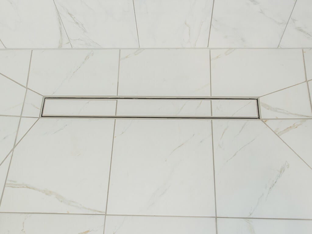 White handicap bathroom remodel linear shower drain with mosaic tile in Mt Tabor, NJ renovated by JMC Home Improvement Specialists