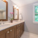 Master bathroom remodel with his and hers wood vanity, quartz counters, wood framed mirrors and chrome finishes in Mendham, NJ renovated by JMC Home Improvement Specialists