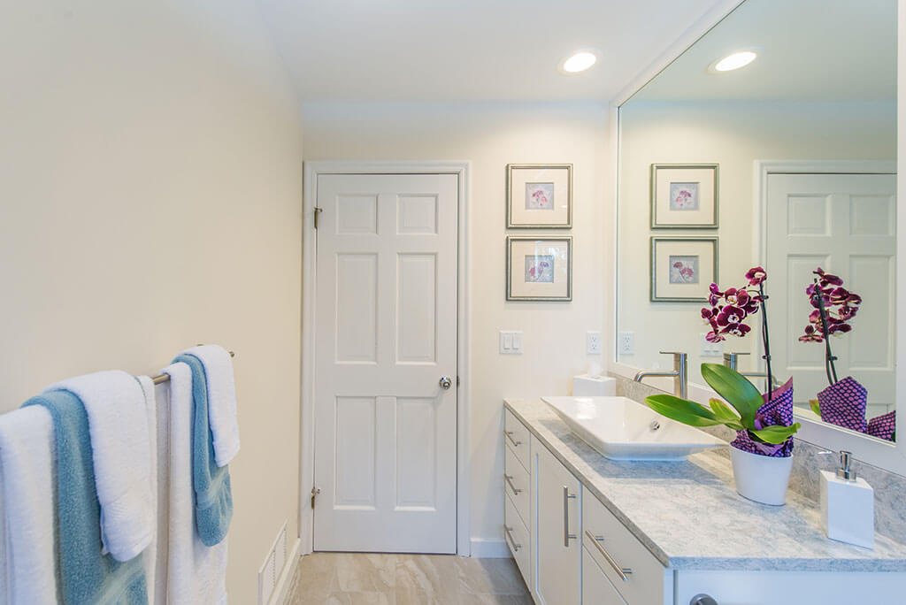 Hall bathroom remodel with sink, quartz counter and white shaker cabinet vanity in Chester, NJ renovated by JMC Home Improvement Specialists