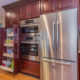 Kitchen remodel with cherry cabinets and roll out shelving in pantry, stainless steel appliances and hardwood flooring in Morris Plains, NJ renovated by JMC Home Improvement Specialists
