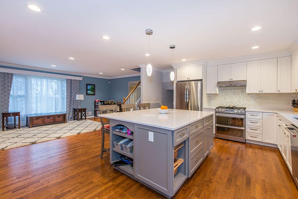 Wall removed to create open concept kitchen with two tone, white cabinets, grey island in Randolph, NJ remodeled by JMC Home Improvement Specialists