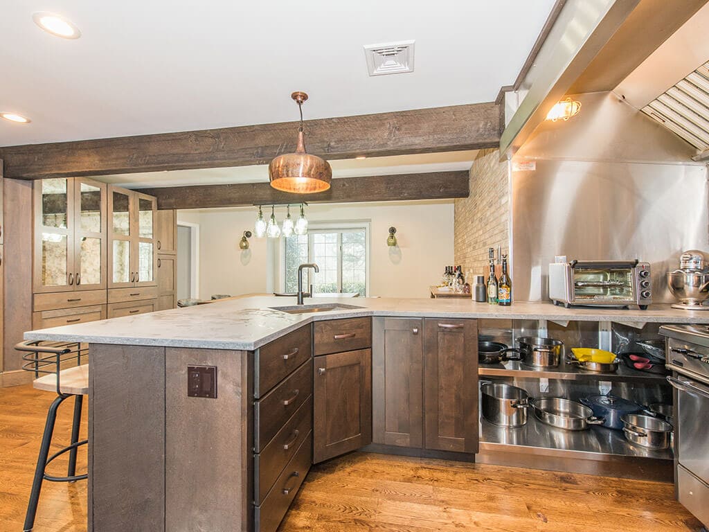 Open concept industrial kitchen with concrete countertop in Rockaway, NJ remodeled by JMC Home Improvement Specialists