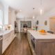 Two tone kitchen with drift wood island and farmhouse sink in Randolph, NJ renovated by JMC Home Improvement Specialists