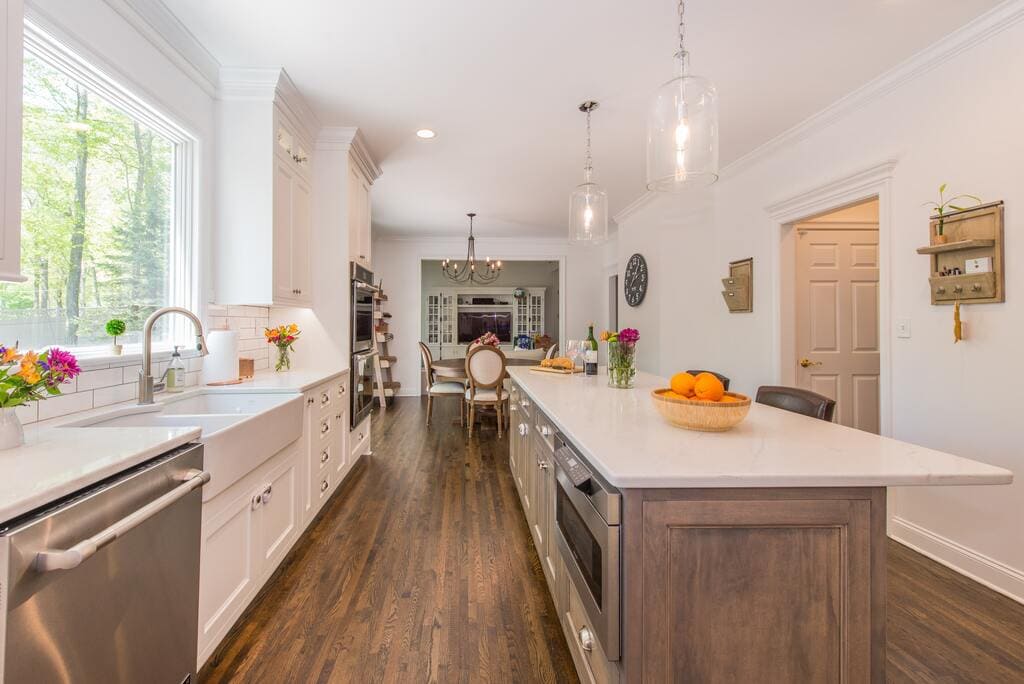 Two tone kitchen with drift wood island and farmhouse sink in Randolph, NJ renovated by JMC Home Improvement Specialists