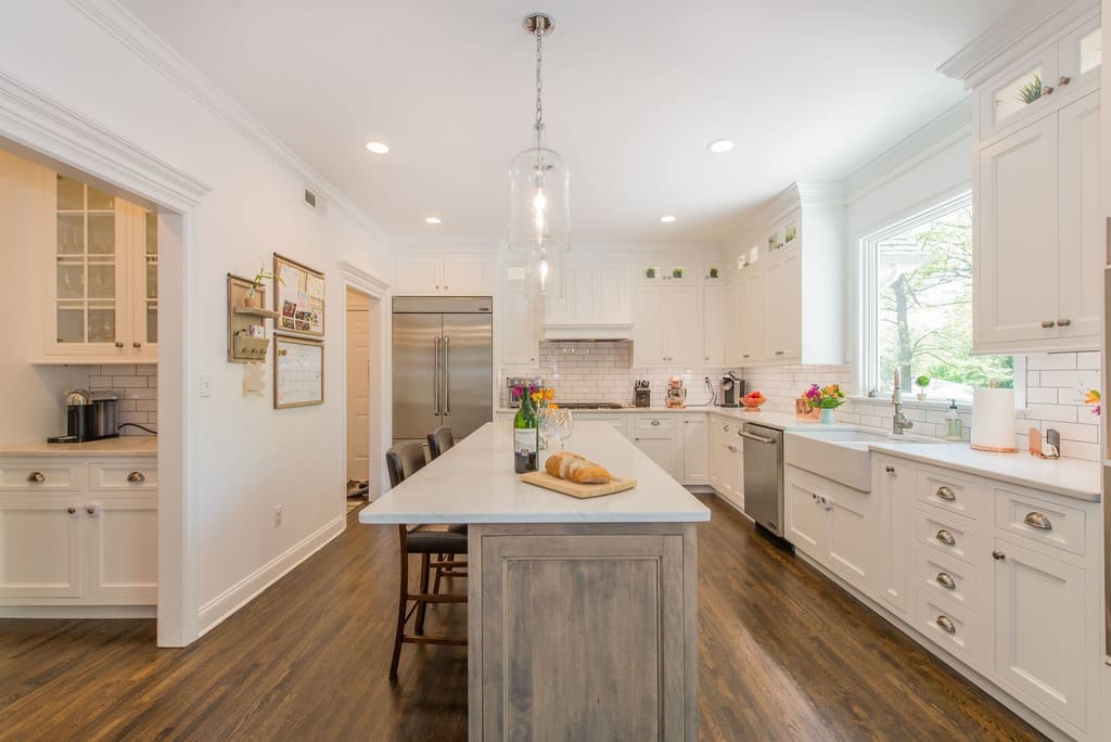 White shaker kitchen cabinets with cup pulls and glass cabinets and butlers pantry in Randolph, NJ remodeled by JMC Home Improvement Specialists