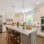 White Kitchen with Drift Wood Accent Island in Randolph
