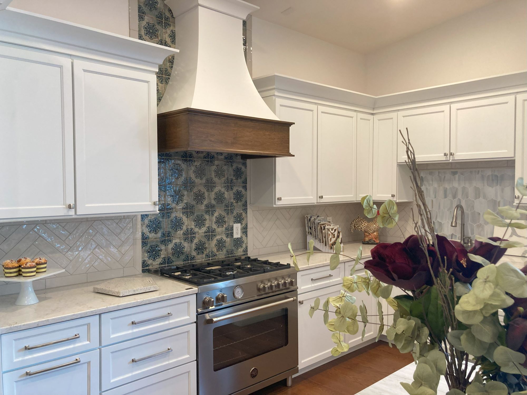 Kitchen Remodel with Statement Tile Stove Backsplash and Custom Range Hood
