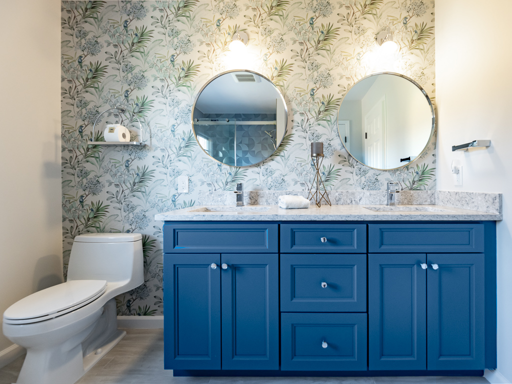 Modern Main Bath with Shower and window with blue cabinets bathroom remodel renovated by JMC Home Improvement Specialists