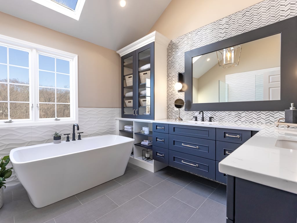 Modern Master Bath with Soaking Tub  and Storage blue cabinets bathroom remodel renovated by JMC Home Improvement Specialists