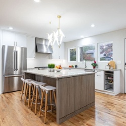 A Livingston Kitchen Remodel with large island and bird chandelier