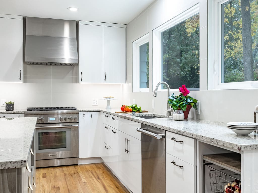 Kitchen Remodel with bird chandelier, twig branch cabinet drawer pulls, leaf handles with two tone accents in Livingston , NJ renovated by JMC Home Improvement Specialists