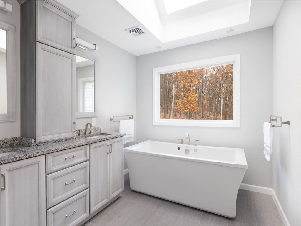 Master Bathroom remodel with soaking tub, walk in shower, double vanity and skylight in Morris County, NJ renovated by JMC Home Improvement Specialists