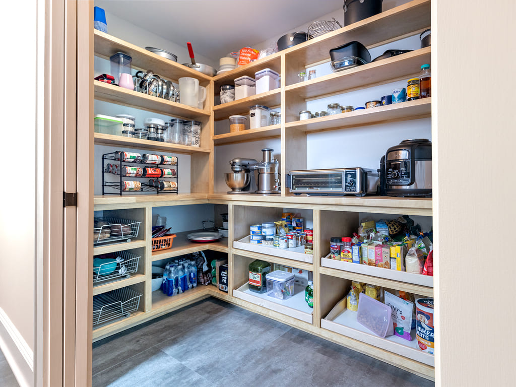 Kitchen remodel with large tile backspalsh, Vinyl flooring, black island,  flat panel cabinets, large walk-in pantry in Morris Plains, NJ remodeled by JMC Home Improvement Specialists