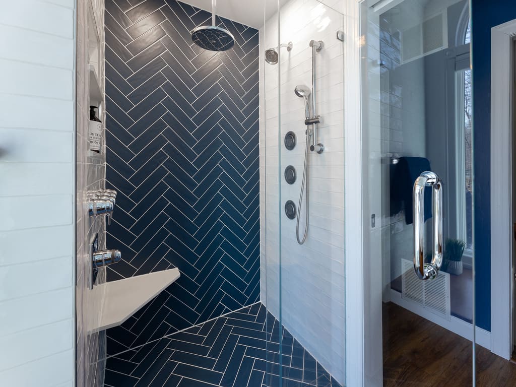 Blue chevron shower tile in bathroom remodel in Byram NJ renovated by JMC Home Improvement Specialists 