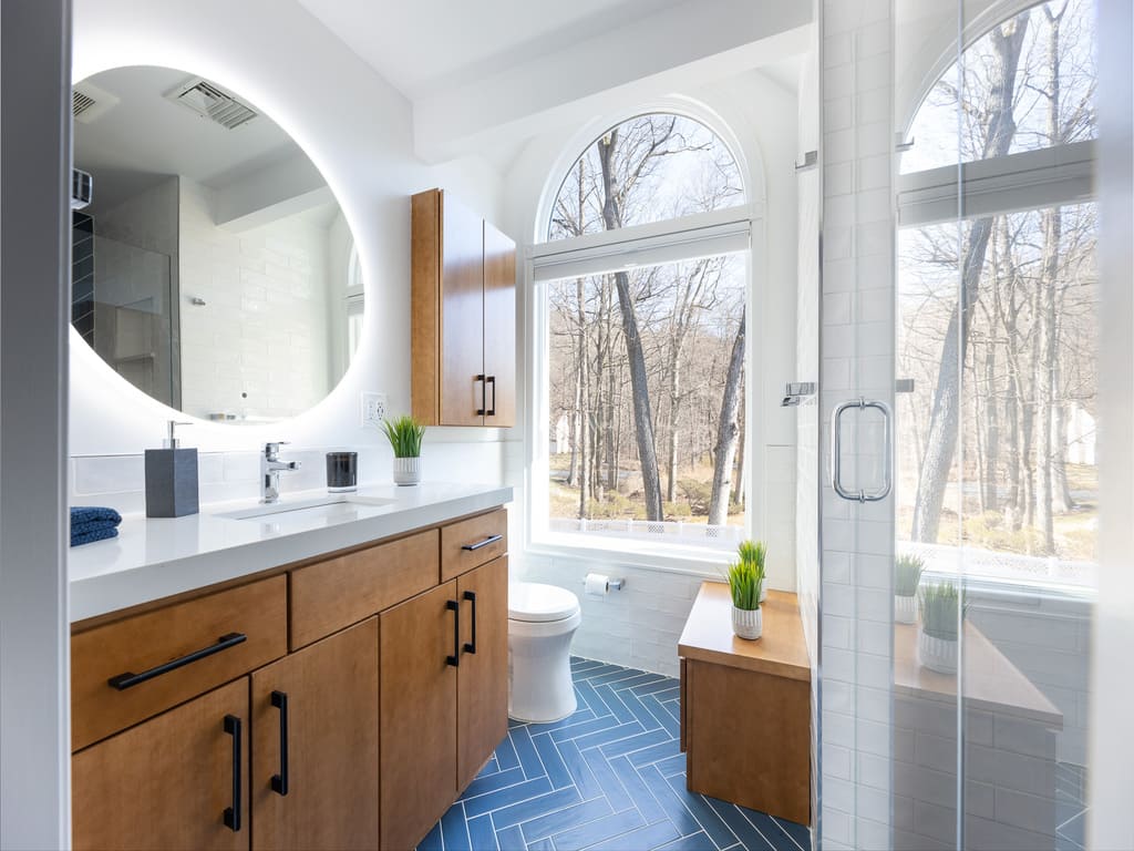 Blue chevron shower tile in bathroom remodel in Byram NJ renovated by JMC Home Improvement Specialists 