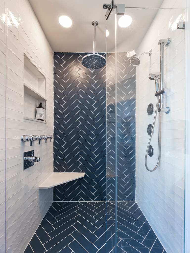 Blue chevron shower tile in bathroom remodel in Byram NJ renovated by JMC Home Improvement Specialists 