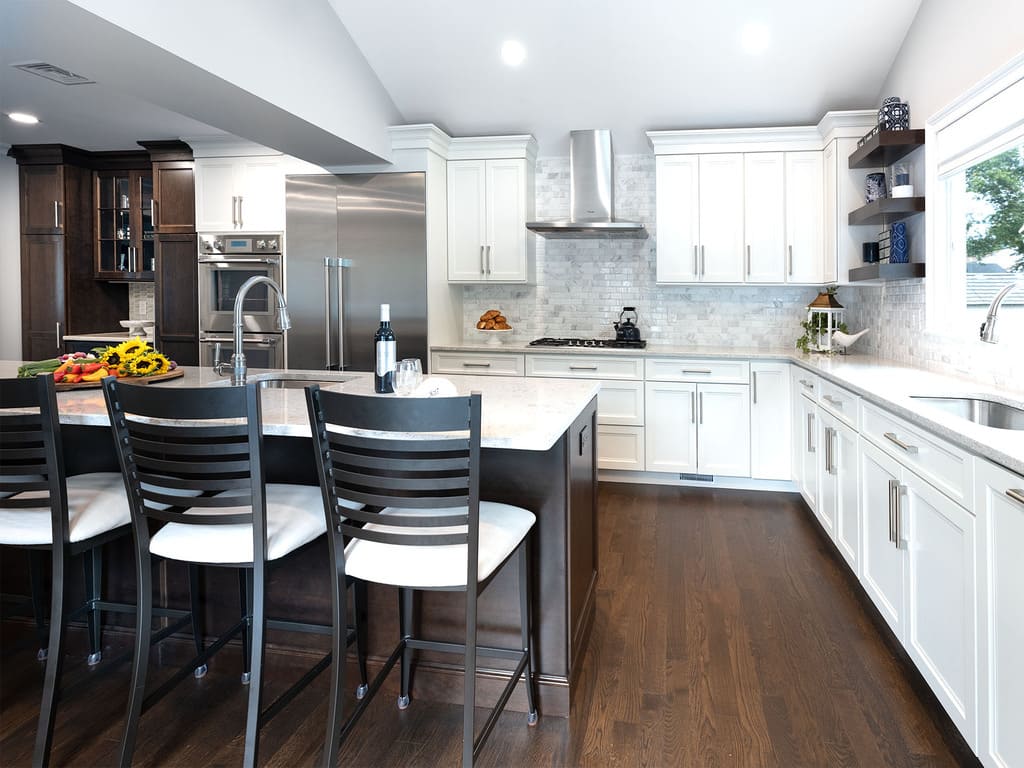 Two-tone kitchen remodel with cooktop, microwave drawer, double oven, kitchen island with prep sink in West Caldwell, NJ renovated by JMC Home Improvement Specialists