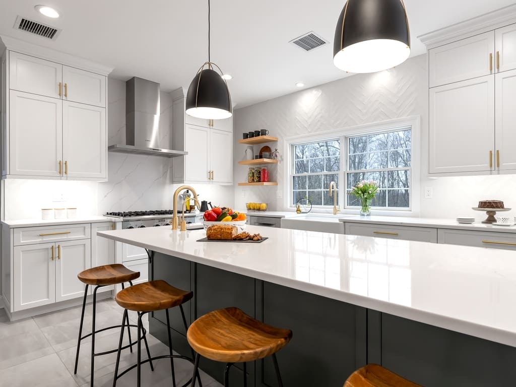 Two tone modern kitchen remodel with brushed gold accents in Towaco, NJ renovated by JMC Home Improvement Specialists