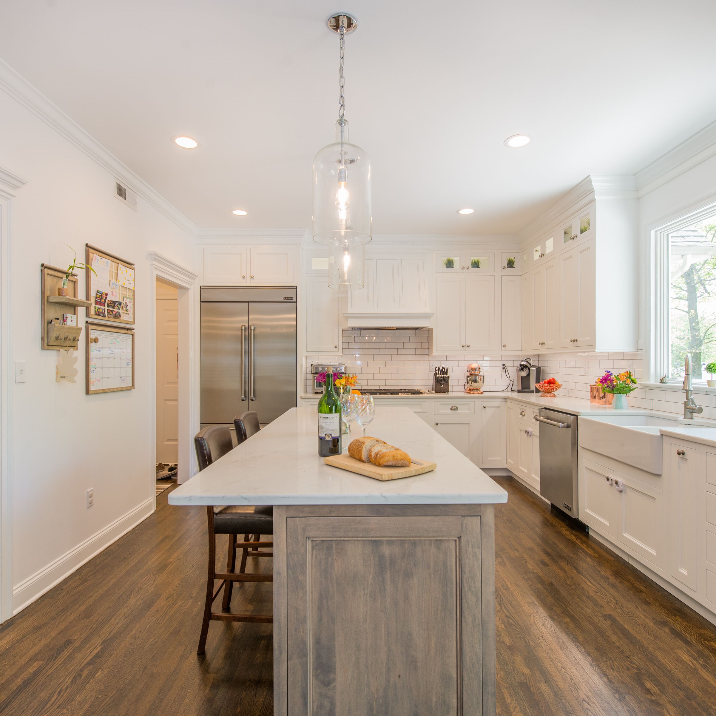 A White Kitchen with Drift Wood Accent Island in Randolph