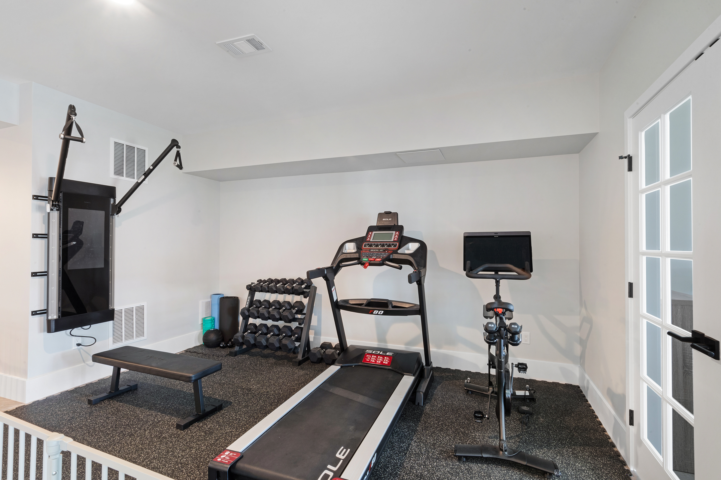 Basement and Bathroom remodel with matte black, barn door slider, shaker style door, polished ceramic subway tile in Cedar Grove, NJ renovated by JMC Home Improvement Specialists