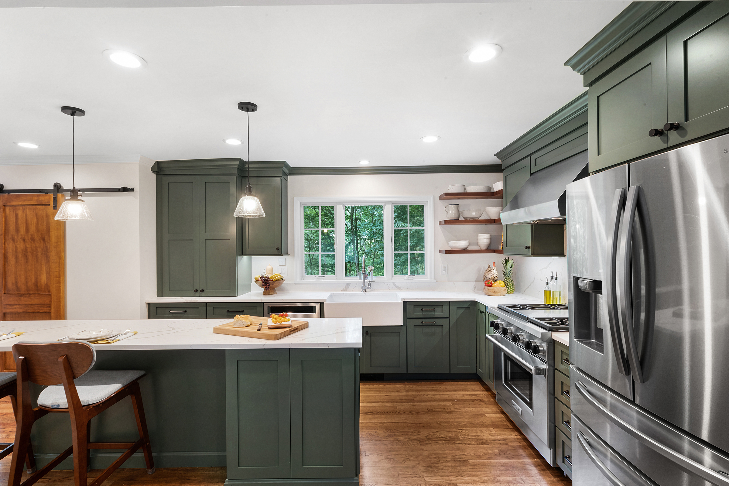 Mendham farmhouse kitchen remodel with lily pad green shaker cabinet doors, quartz and butcher block with farmhouse sink and Anderson windows.